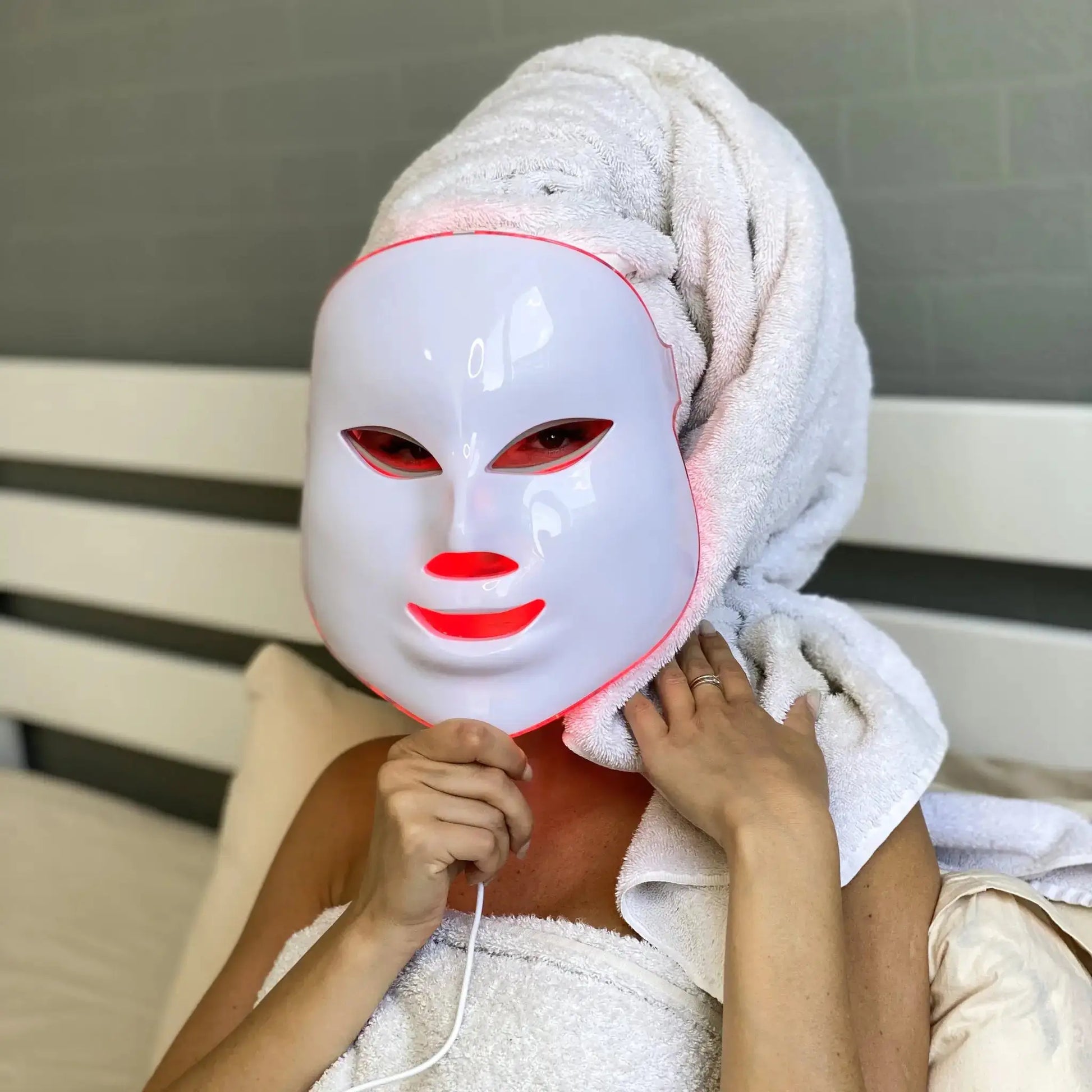 LED skincare mask for wrinkle reduction in use, featuring red light therapy for skin rejuvenation and improved texture at home.