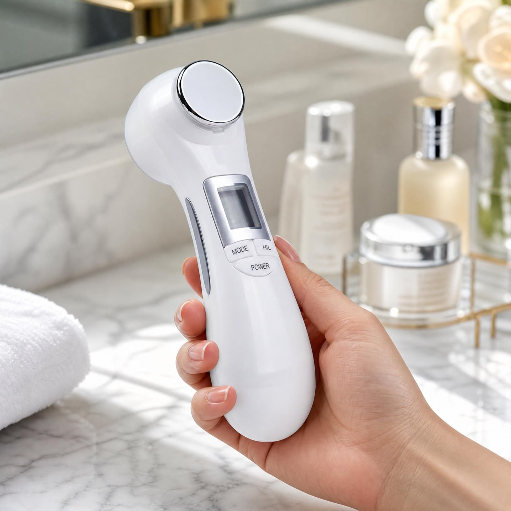 Close-up of the 6-in-1 beauty device in a model's hand, showing its ergonomic design and smooth matte finish against a modern bathroom background.