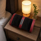 Foot massager on a bedroom bedside table highlighting ergonomic and compact design.