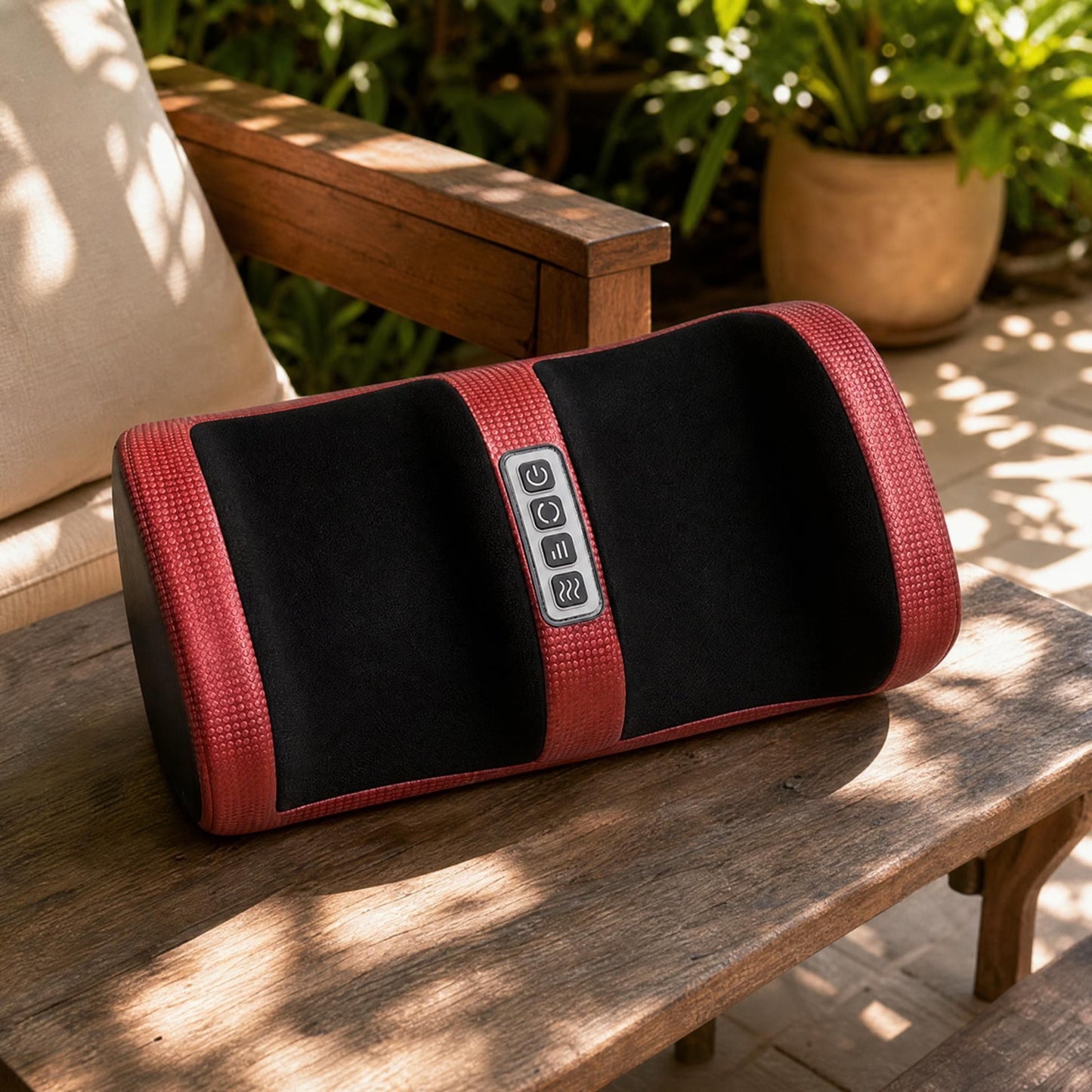 Foot massager placed on a wooden bench in a sunlit garden patio showing outdoor use.